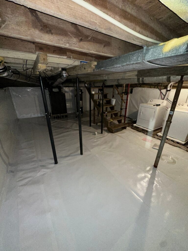 Encapsulated basement with vapor barrier and sealed walls for moisture control